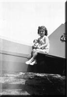 Young Donna beside an airplane in Pittsburg, Kansas.