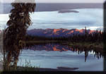 Sunset at Beaver Pike, the Alaska Range reflected in the Tanana River.
