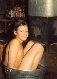Bathtime for Ricky beside the wood stove.