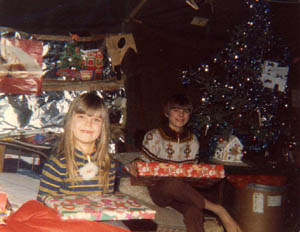 Christmas in the tent: Katherine and Ricky open presents.
