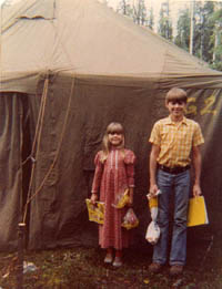 Katherine and Ricky ready for school outside the tent.