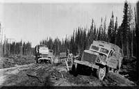 Building the Alaska Highway in 1942: trucks and mishaps.