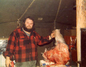Dick butchering a moose hindquarter.